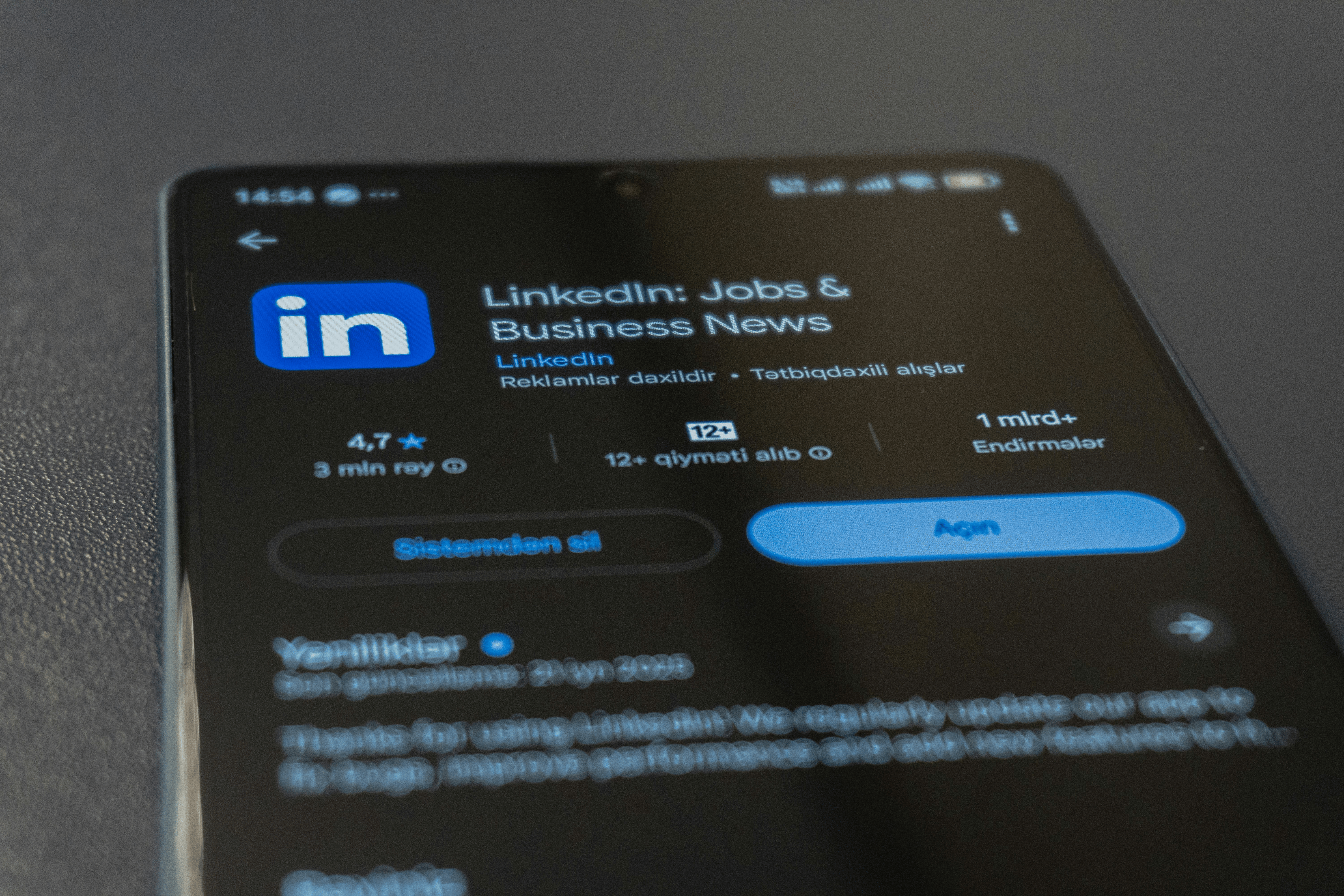 Image shows a mobile phone screen with a sreen shot of LinkedIn account at the login stage